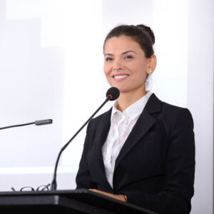 Female speaker at the board. Business conference